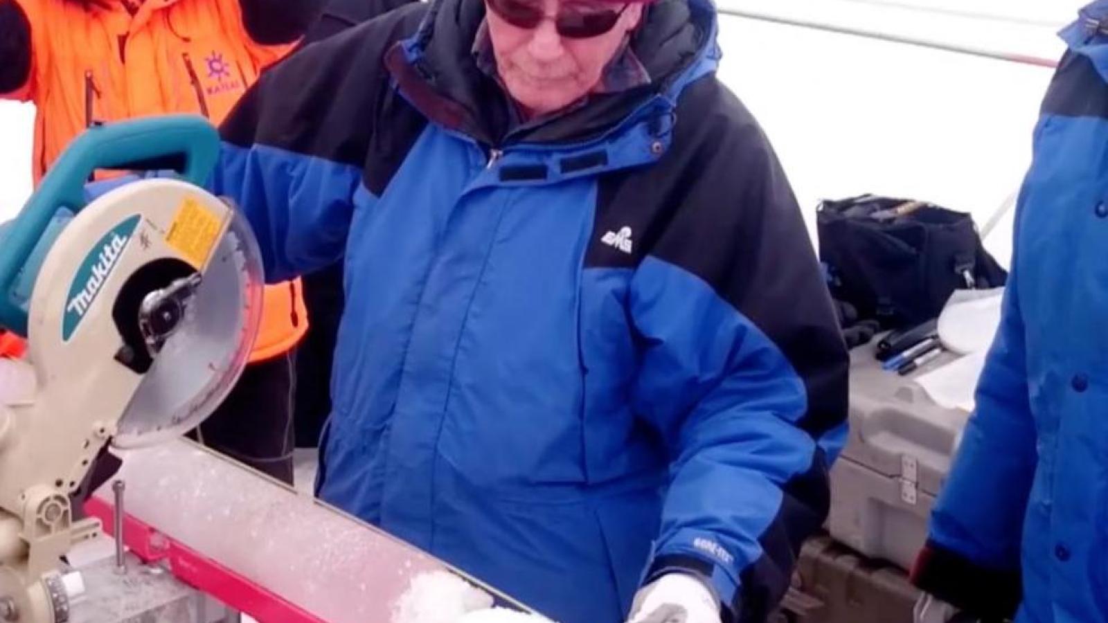 Professor Thompson cuts fresh ice core